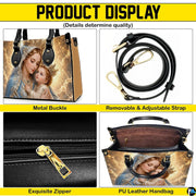 Back view of Madonna and Child handbag showing coordinated golden celestial design