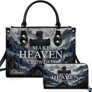 Front view of mountain peak stone cross handbag and matching wallet set with misty alpine scenery