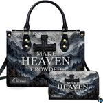 Front view of mountain peak stone cross handbag and matching wallet set with misty alpine scenery