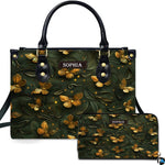 Handbag and matching wallet set featuring embossed golden butterflies on forest green.