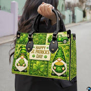 Model carrying green gnome clover handbag with gold accents
