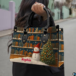 Lifestyle presentation of holiday bookshelf handbag carried by top handle on street