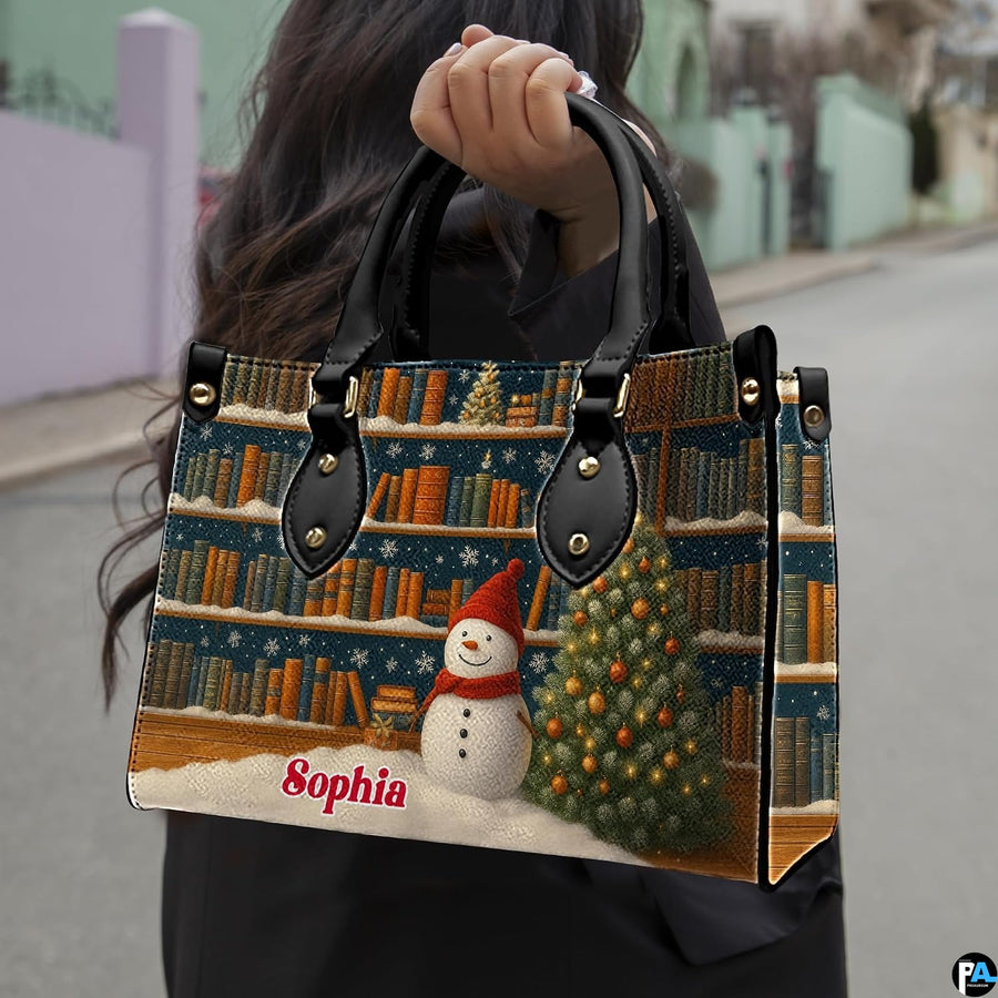 Lifestyle presentation of holiday bookshelf handbag carried by top handle on street