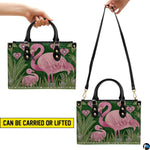 Top-down view displaying interior compartment and black carrying handles of the handbag.
