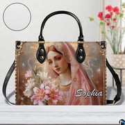 Handbag with Virgin Mary and lilies portrait displayed with texture zoom inset