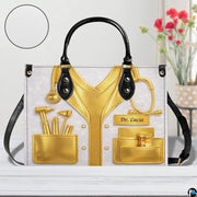Contextual lifestyle display of the gold doctor coat handbag in an interior room setting.
