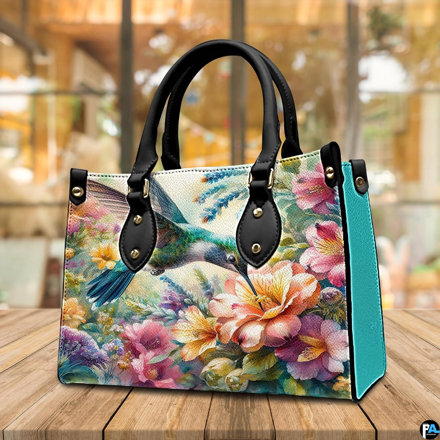 Back view of floral garden handbag showing continuous watercolor illustration on white background.