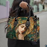 Model wearing Byzantine mosaic handbag over shoulder with attached strap.