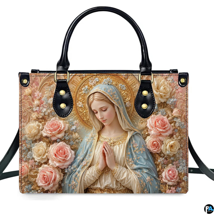 Top view of praying Madonna handbag displaying top zipper opening and carry handles