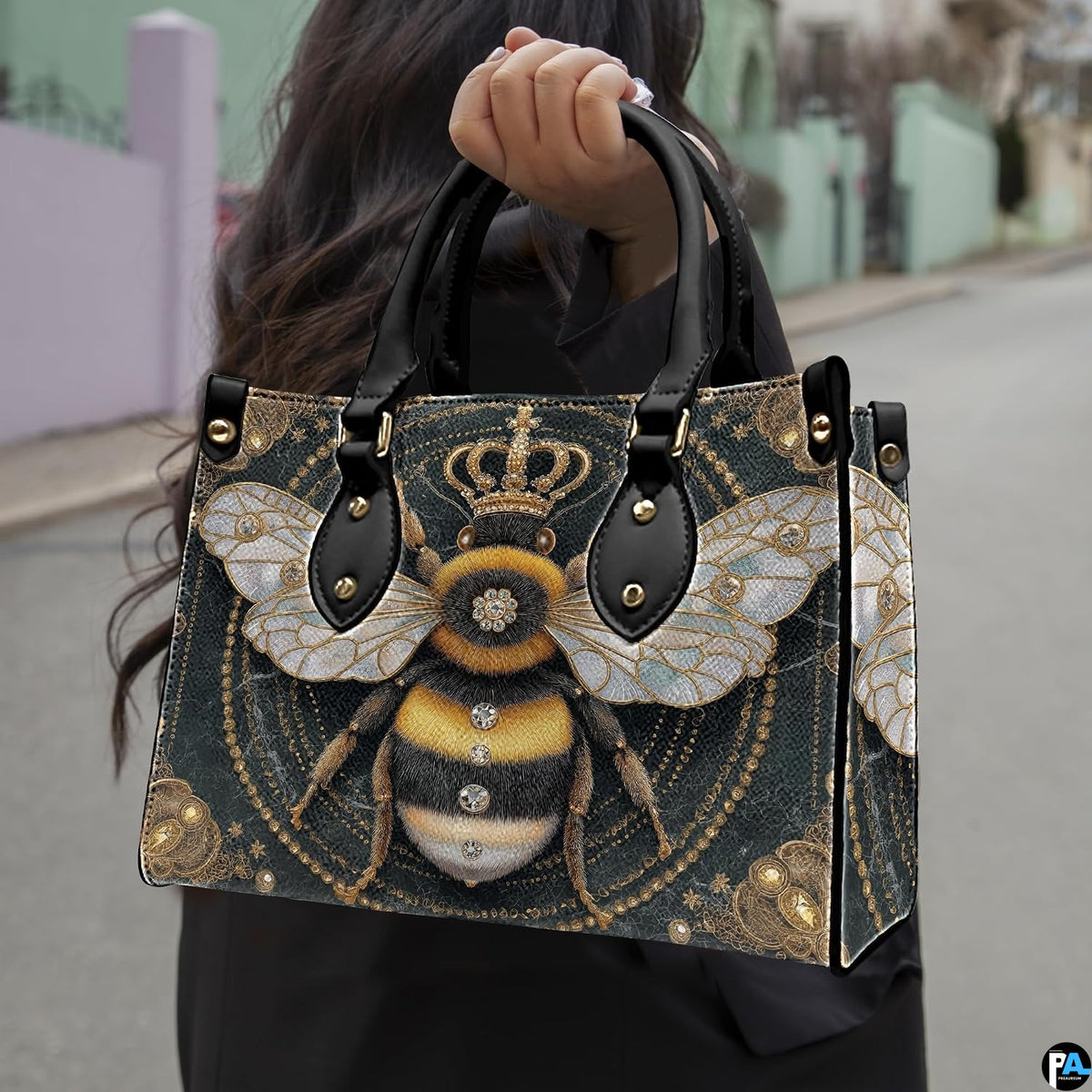 Matching zip wallet featuring the crowned bumblebee graphic and black marble backdrop.