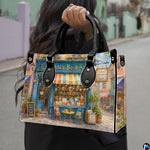 Top-down view of the handbag highlighting clean upper lines and dual carrying handles.