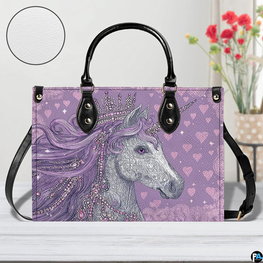 Angle perspective view of the unicorn handbag showcasing side depth and printed graphic.
