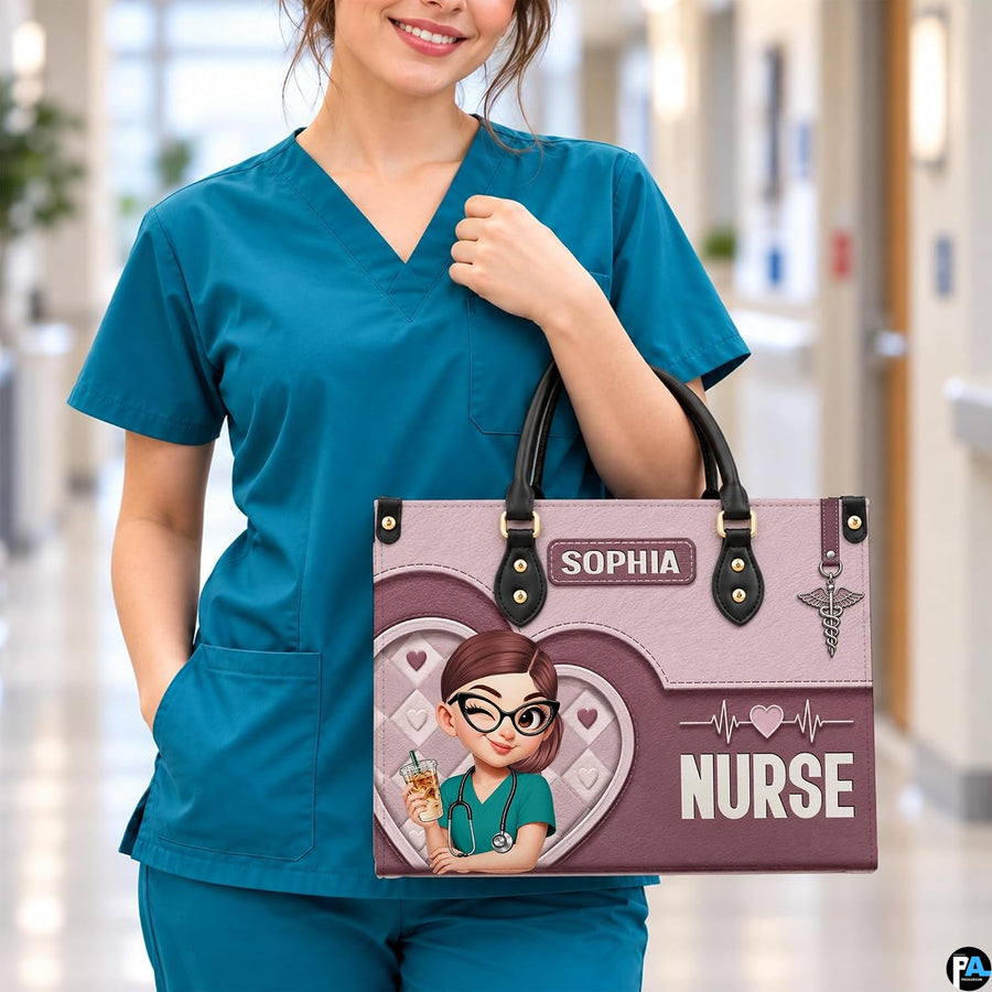 Chibi nurse pink quilted heart handbag carried on forearm by medical provider in hospital hallway.