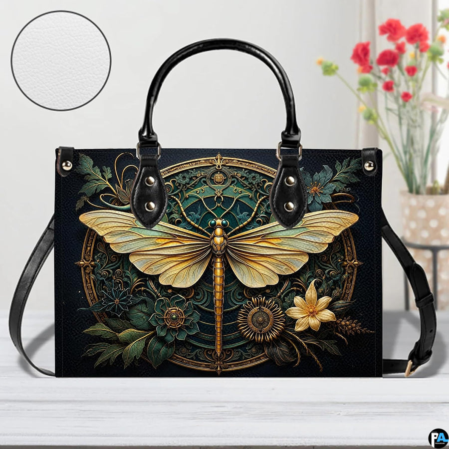 Interior view of gold dragonfly handbag showing open storage compartment with fabric lining