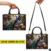 Peacock floral handbag shown in top-handle and shoulder carry styles