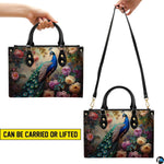 Peacock floral handbag shown in top-handle and shoulder carry styles