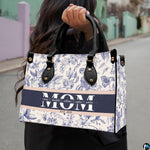 Model showcasing blue toile floral design outdoors along a quiet pathway.
