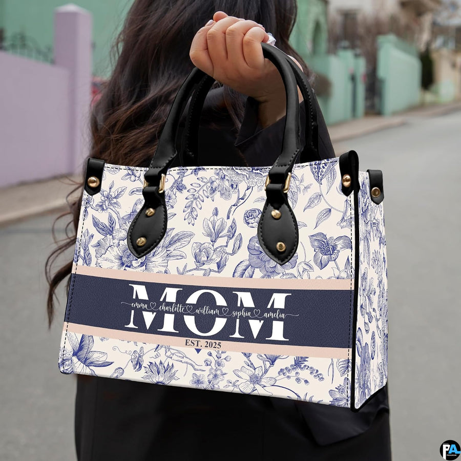 Model showcasing blue toile floral design outdoors along a quiet pathway.