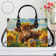 Studio presentation on light wooden planks featuring the floral crowned cow calf artwork and floral vase.