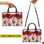 Carrying demonstration showing dual handles and shoulder strap options for the gingerbread holiday handbag.