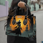 Frontal presentation highlighting the hooded witch art design on the primary accessory silhouette.