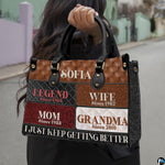 Front view of patchwork handbag featuring diamond tufted patterns and multi-toned rectangular blocks.