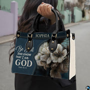 Outdoor lifestyle presentation showcasing the floral devotional handbag carried by an individual.