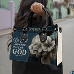 Outdoor lifestyle presentation showcasing the floral devotional handbag carried by an individual.