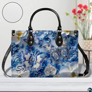 Close-up front view of matching zippered wallet showing blue butterfly