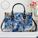 Close-up front view of matching zippered wallet showing blue butterfly