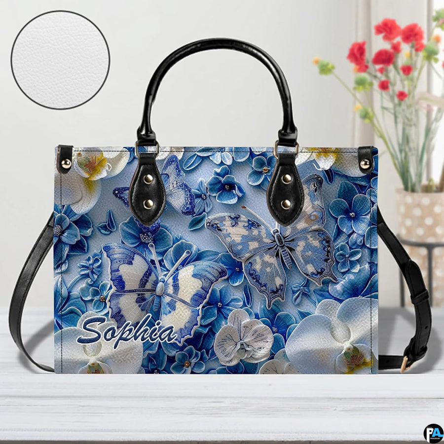 Close-up front view of matching zippered wallet showing blue butterfly