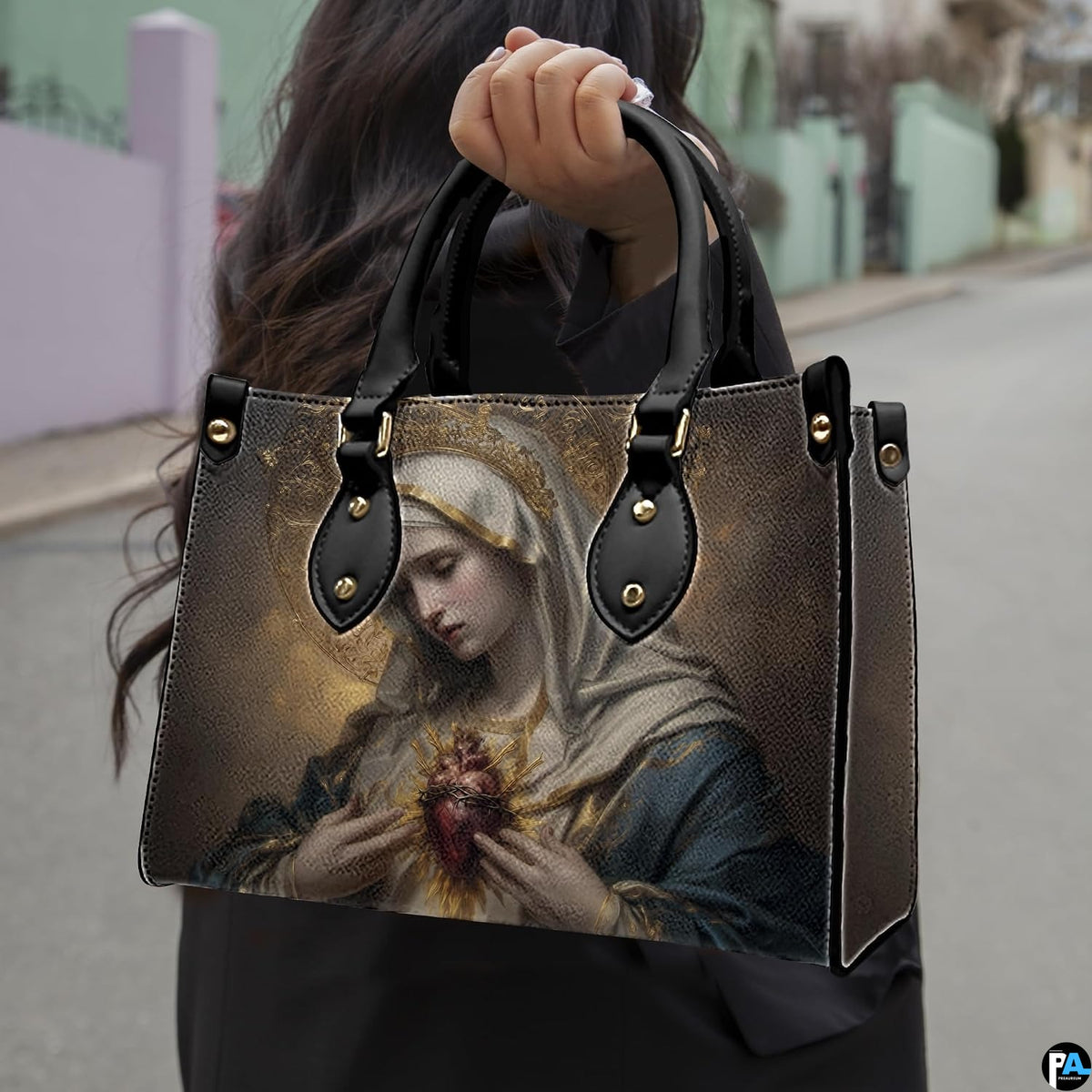 Model carrying the Immaculate Heart of Mary devotional handbag outdoors on street sidewalk