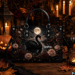 Frontal presentation highlighting the black swan art design on the primary accessory silhouette.