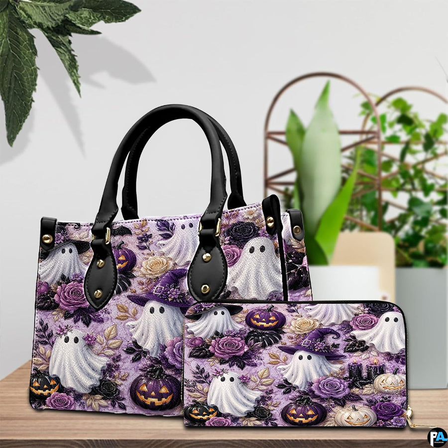 Cute ghost handbag and wallet displayed on wooden table beside potted plant.