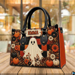 Outdoor perspective of the autumn ghost satchel positioned on a wooden patio table.