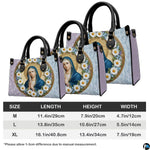 Detailed view of coordinating wallet with daisy-framed Virgin Mary portrait
