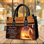Empty tomb handbag displayed on wooden tabletop in a bright interior room