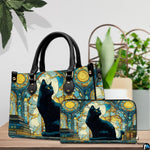 Tabletop arrangement showing cat on books stained glass art beside lush potted foliage.
