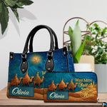 Perspective view of three magi desert journey handbag and wallet matching pair