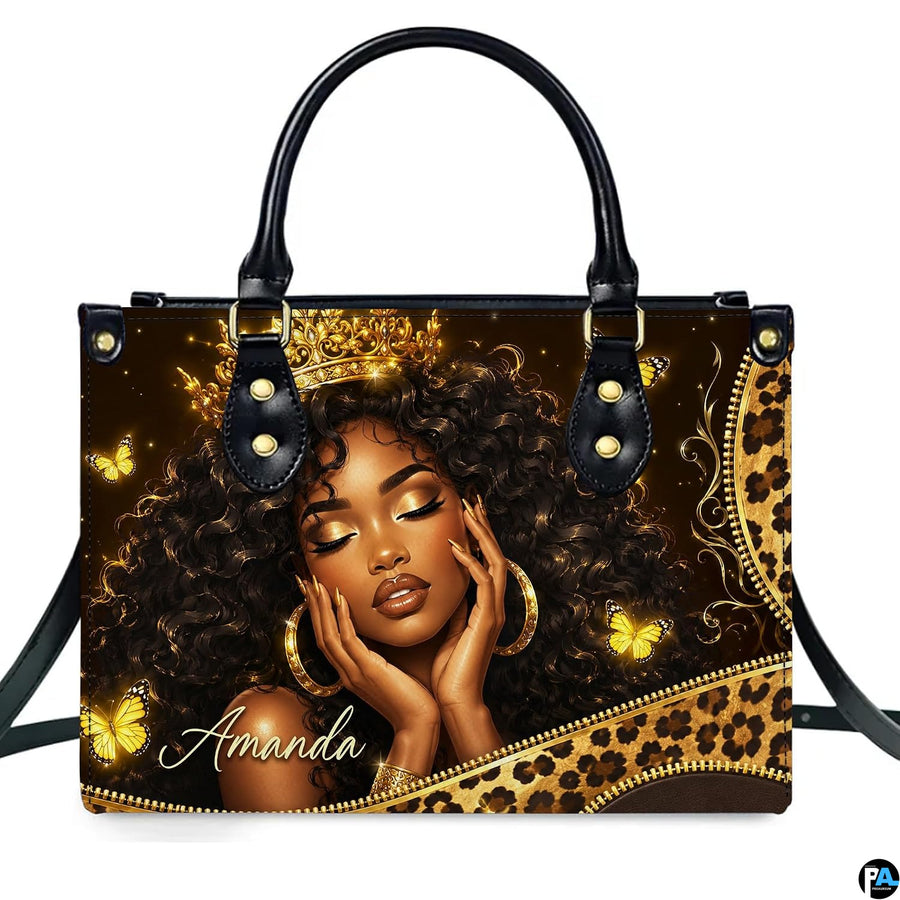 Front view of crowned queen graphic art resting on bright desk surface.