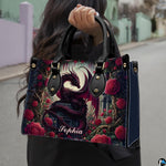 Outdoor lifestyle shot of model carrying gothic crimson dragon handbag.
