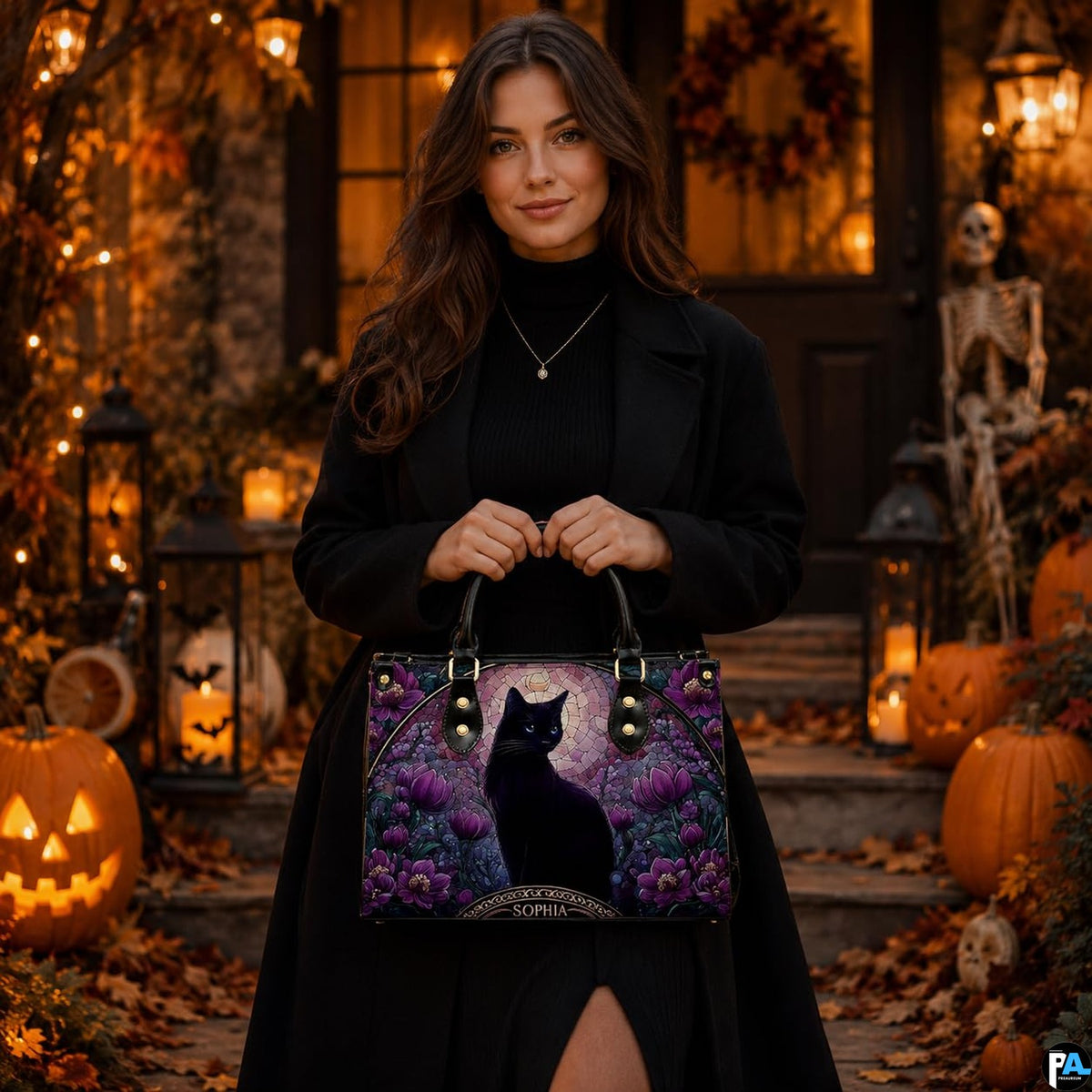 Lifestyle view highlighting stained glass black cat artwork in front of autumn porch decor with pumpkins.