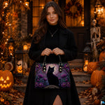 Lifestyle view highlighting stained glass black cat artwork in front of autumn porch decor with pumpkins.