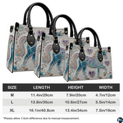Top-down view displaying interior compartment and black carrying handles of the handbag.
