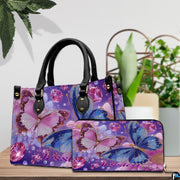 Front view of twin butterfly handbag displaying detailed cobalt and magenta butterfly artwork.