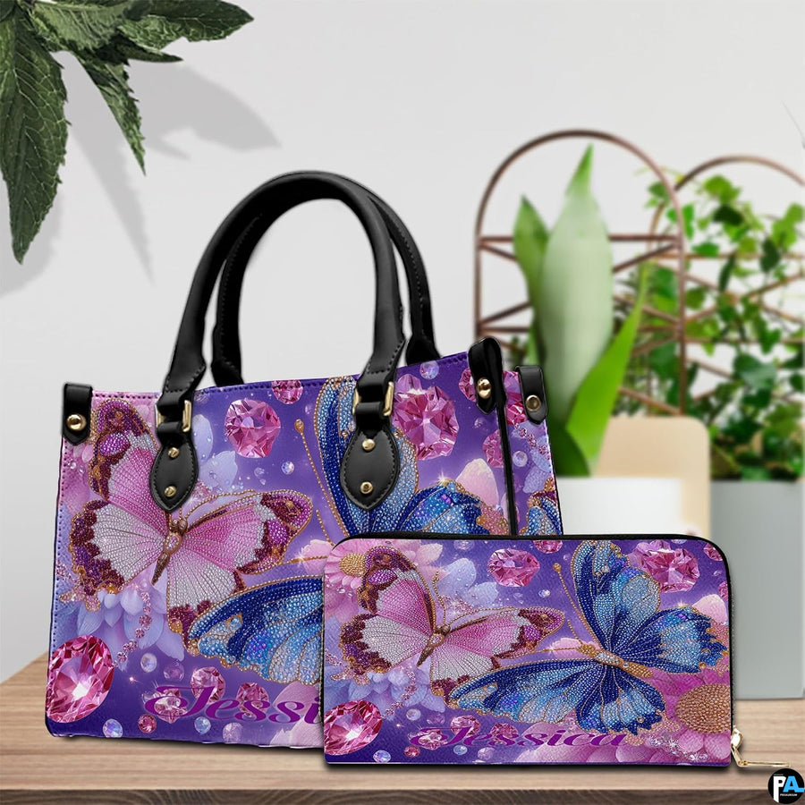 Front view of twin butterfly handbag displaying detailed cobalt and magenta butterfly artwork.