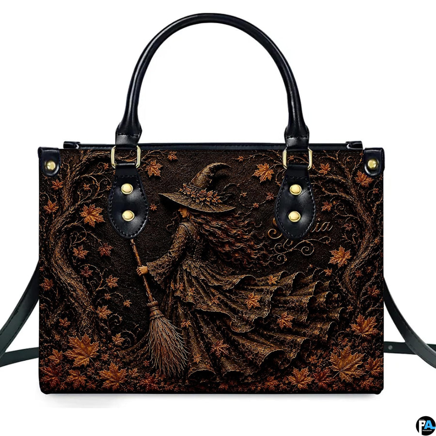 Isolated front view showcasing the autumn witch art graphic depicting the sorceress and ancient trees.