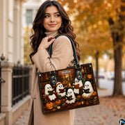 Lifestyle view of model wearing ghost book club satchel on shoulder walking along autumn street.