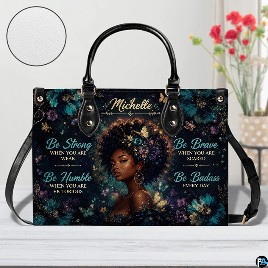 Front view of floral afro handbag with butterflies and gold accents