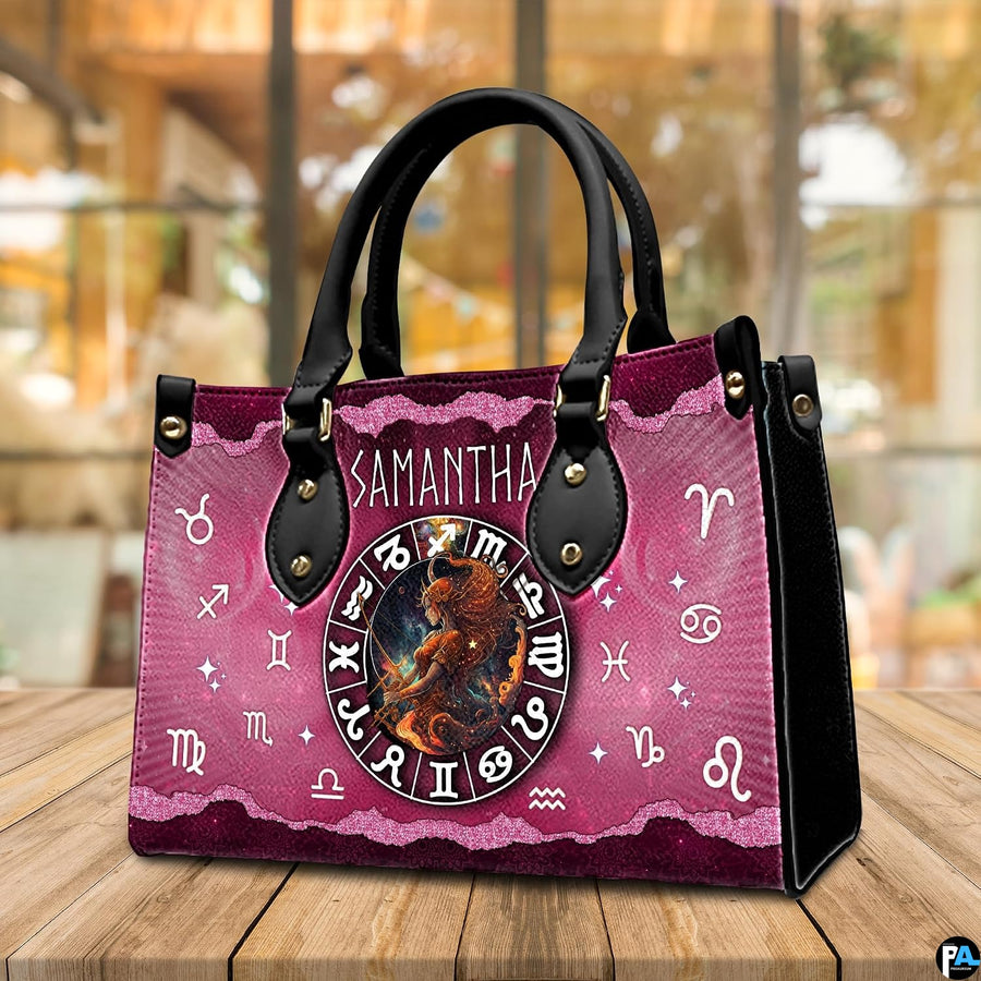 Tabletop perspective of Celestial Archer Satchel Handbag resting on indoor wooden surface.